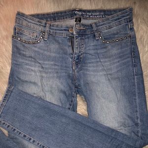 Light wash gap jeans with stud embellishments.